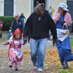 From left, Juno Kullgren, 3, with her Father Peter Kullgren, and mother Mary Ellen Kulgren, all of Gloucester, set out in Little Red Ridinghood themed costumes to go Trick of Treating in Gloucester. Due to the threat of Hurricane Sandy, Gloucester Mayor Carolyn Kirk encouraged residents to celebrate Halloween on Sunday. JOSH REYNOLDS FOR THE BOSTON GLOBE (Regional, NoWk, Sports)